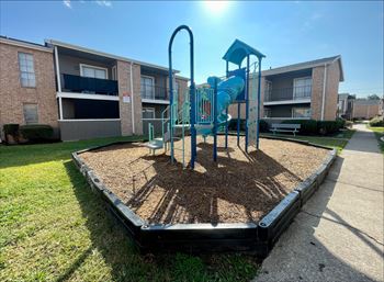 Playground with blue slide and climbing equipment